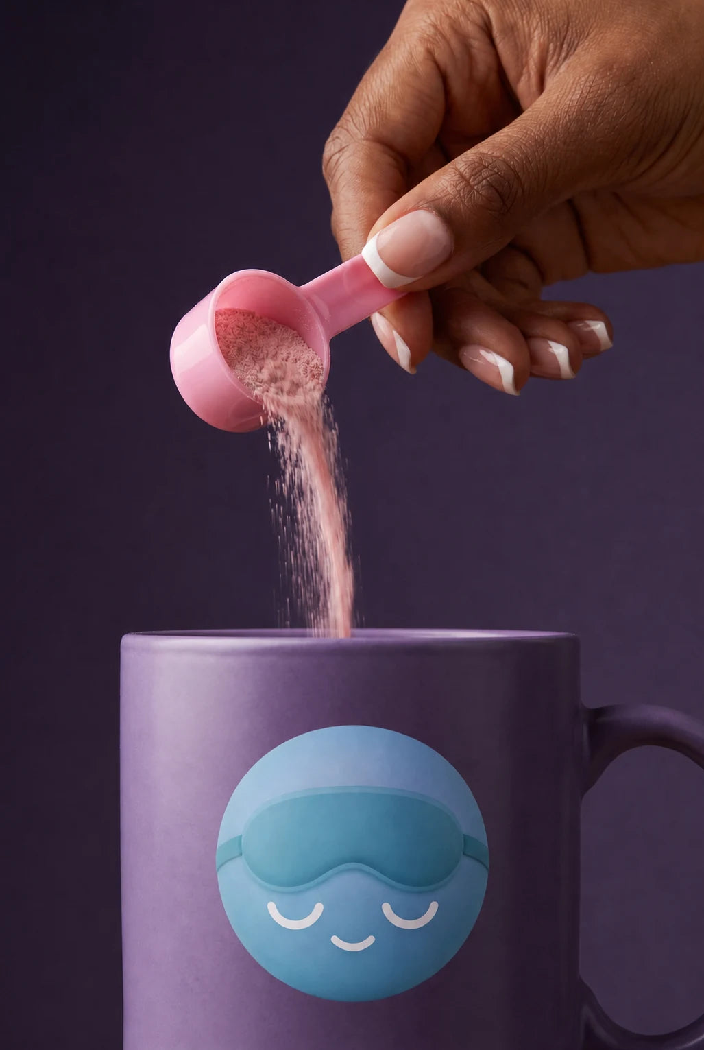 A hand pouring a scoop of Hour Seven tart cherry sleep drink into a mug