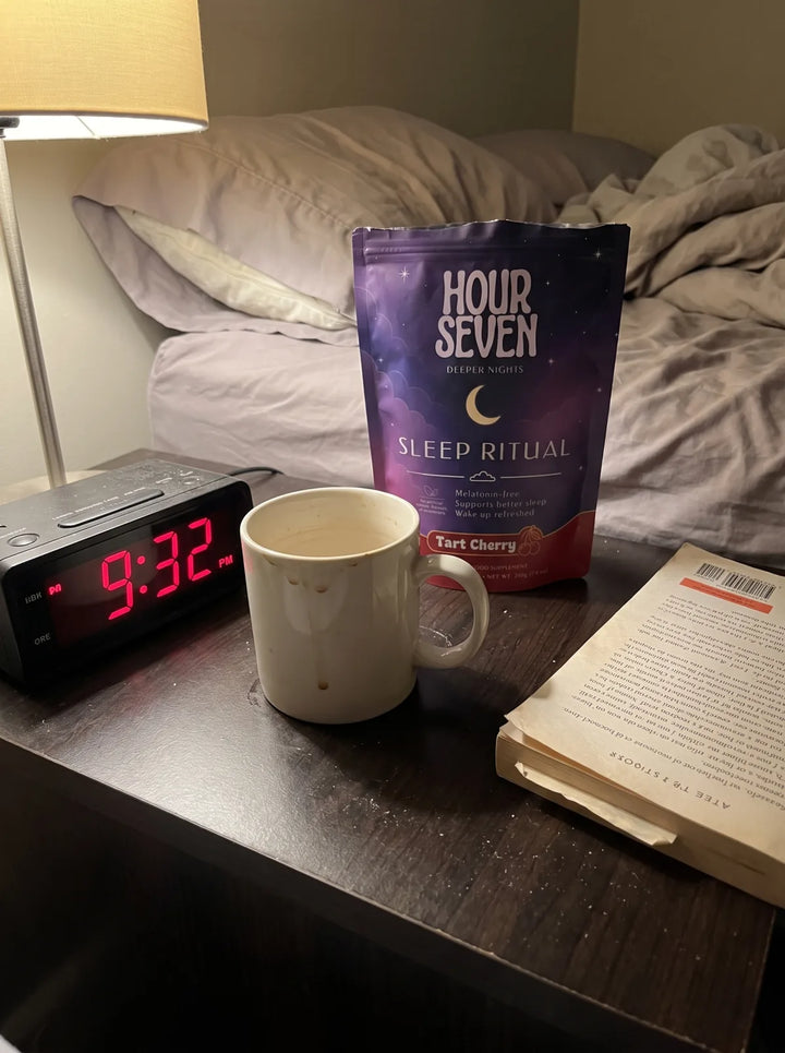 Hour Seven Sleep Ritual beside a warm mug and a clock reading 9:32pm