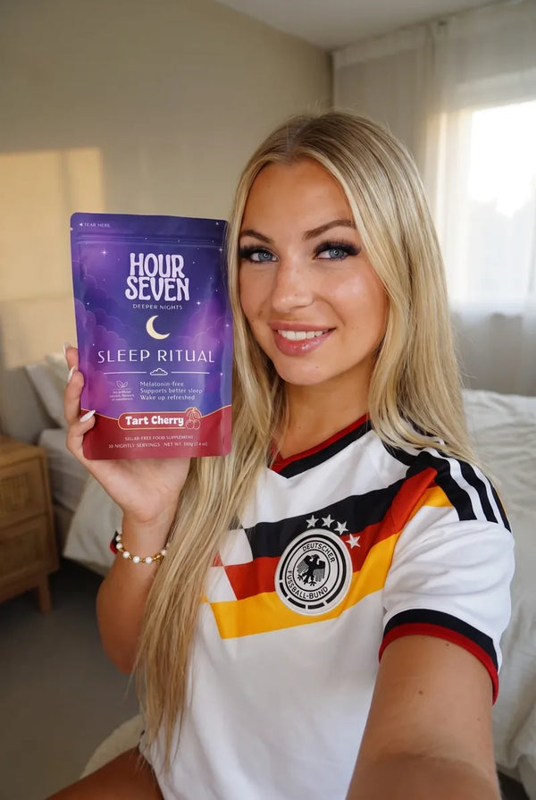 An Hour Seven customer holding a Tart Cherry Sleep Ritual pouch