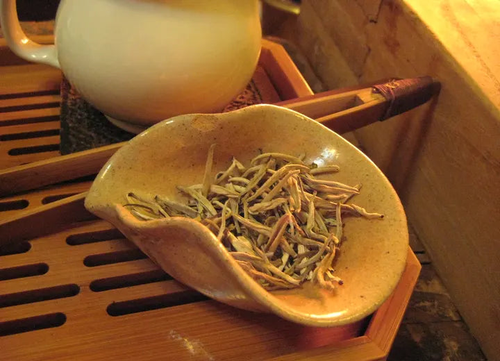 Loose white tea leaves